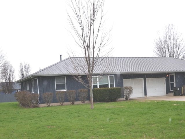 ranch-style home with a front yard, driveway, and a garage