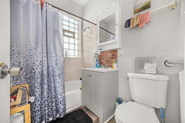 7123 S Green St, Chicago, IL 60621 - full bathroom featuring shower / bath combination with curtain, toilet, vanity, and wood finished floors