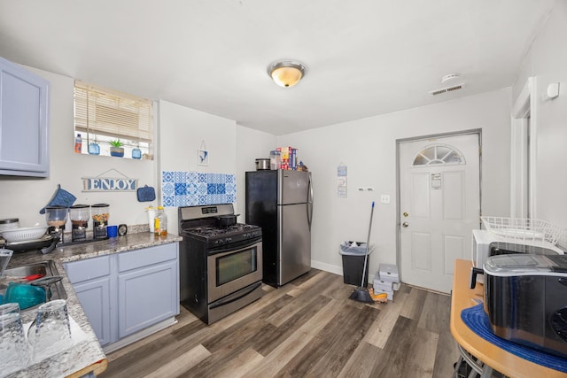 7123 S Green St, Chicago, IL 60621 - kitchen with stainless steel appliances and wood finished floors