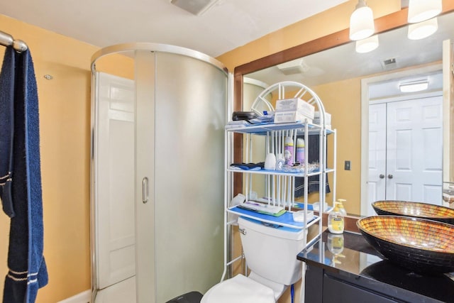 full bathroom with a shower stall, visible vents, toilet, and vanity