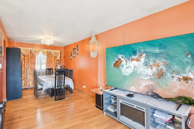 dining area with light wood-style flooring