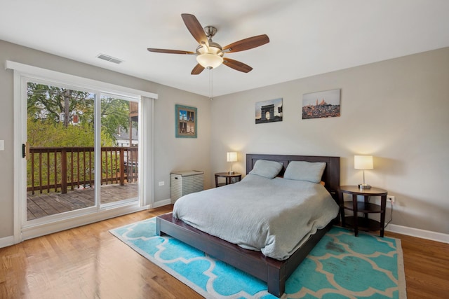 6029 N Ridge Ave, Chicago, IL 60660 - bedroom featuring access to exterior, baseboards, wood finished floors, and ceiling fan