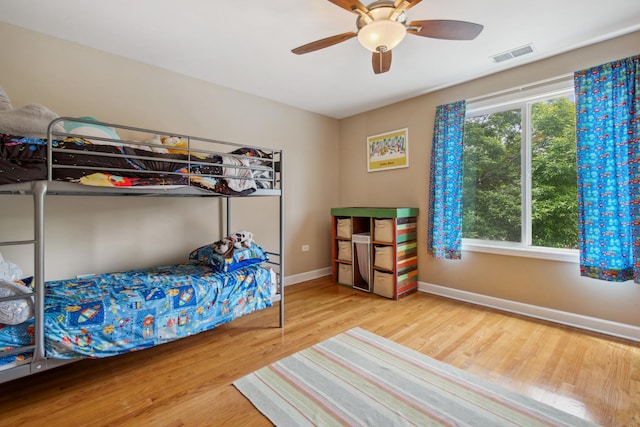 6029 N Ridge Ave, Chicago, IL 60660 - bedroom featuring wood finished floors, baseboards, and a ceiling fan