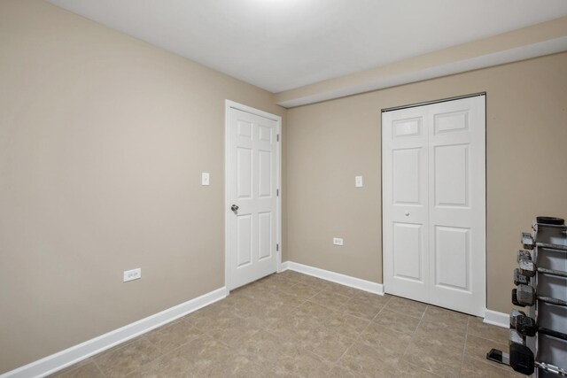 6029 N Ridge Ave, Chicago, IL 60660 - unfurnished bedroom featuring baseboards and a closet