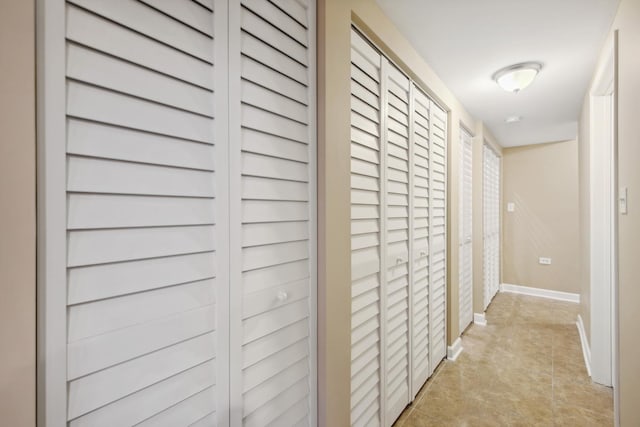 6029 N Ridge Ave, Chicago, IL 60660 - corridor featuring baseboards and light tile patterned floors