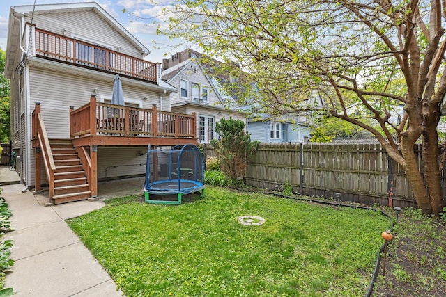 6029 N Ridge Ave, Chicago, IL 60660 - rear view of property with a trampoline, a deck, a balcony, and stairway
