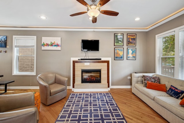 6029 N Ridge Ave, Chicago, IL 60660 - living room featuring ornamental molding, baseboards, a ceiling fan, a glass covered fireplace, and wood finished floors