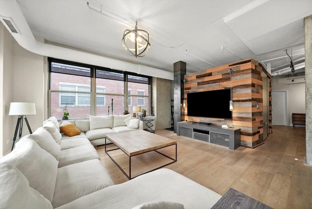 living room featuring hardwood / wood-style floors and visible vents