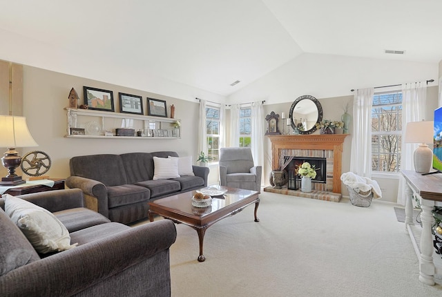 1601 Penny Ln Unit B, Crystal Lake, IL 60014 - carpeted living room with vaulted ceiling, visible vents, and a fireplace
