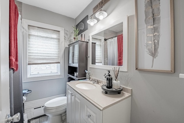 4158 W Nelson St, Chicago, IL 60641 - full bathroom with baseboard heating, vanity, and toilet