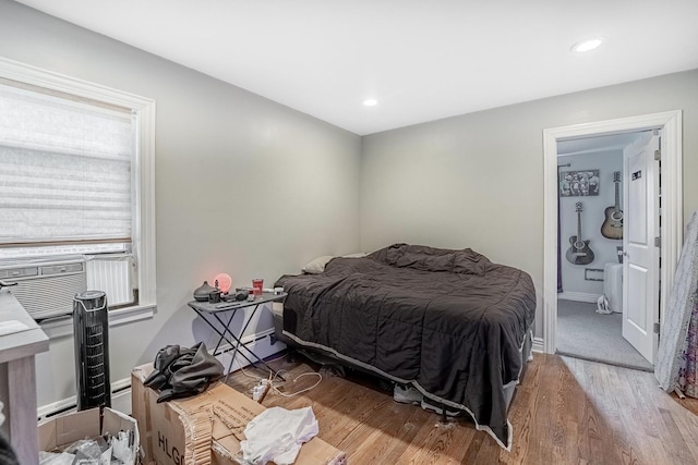 4158 W Nelson St, Chicago, IL 60641 - bedroom with recessed lighting, wood finished floors, baseboards, and baseboard heating