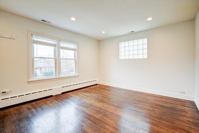 4158 W Nelson St, Chicago, IL 60641 - spare room with a baseboard radiator, plenty of natural light, visible vents, and wood finished floors