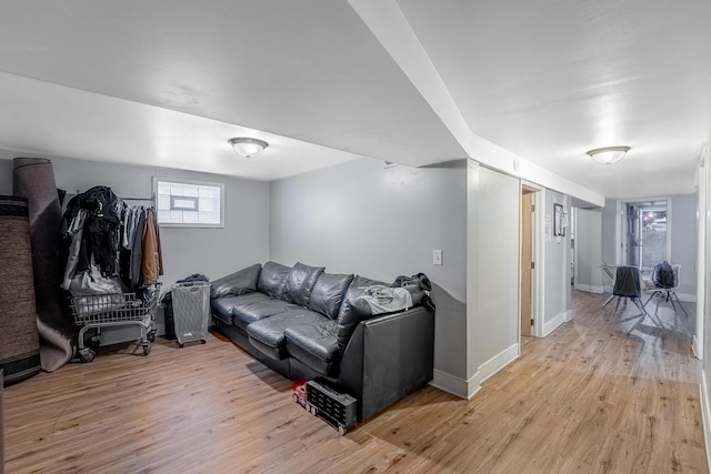 4158 W Nelson St, Chicago, IL 60641 - living room featuring baseboards and light wood-style floors