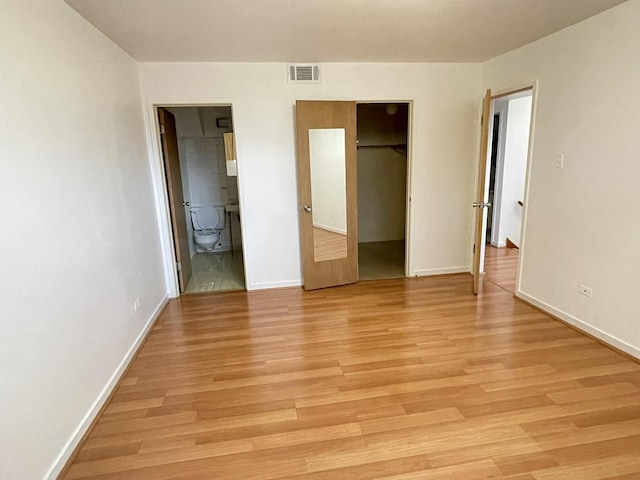 5517 S Dorchester Ave, Chicago, IL 60637 - unfurnished bedroom with baseboards and light wood-type flooring