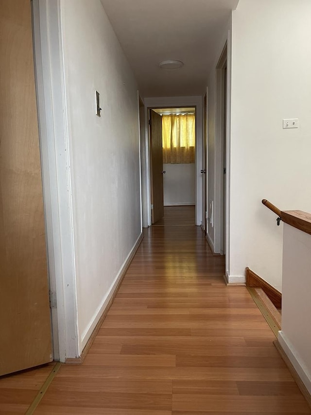 5517 S Dorchester Ave, Chicago, IL 60637 - corridor featuring light wood finished floors and baseboards