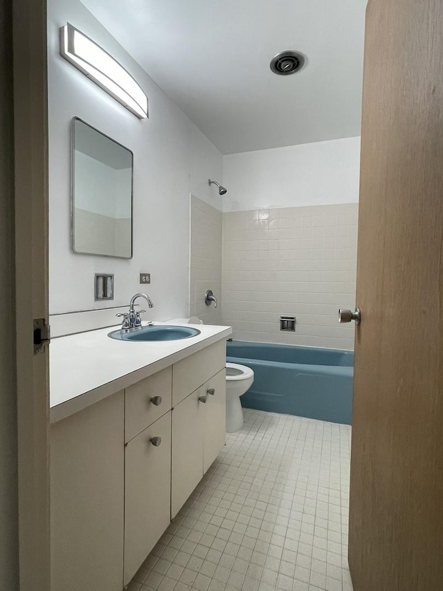 5517 S Dorchester Ave, Chicago, IL 60637 - full bathroom with toilet, tile patterned floors, vanity, and shower / washtub combination