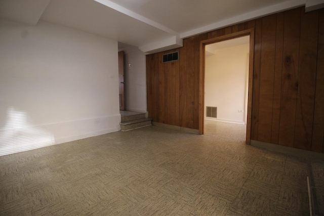 5517 S Dorchester Ave, Chicago, IL 60637 - spare room with baseboards and wooden walls