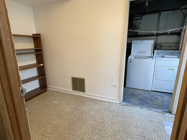 5517 S Dorchester Ave, Chicago, IL 60637 - laundry area with washer and clothes dryer, carpet floors, and baseboards