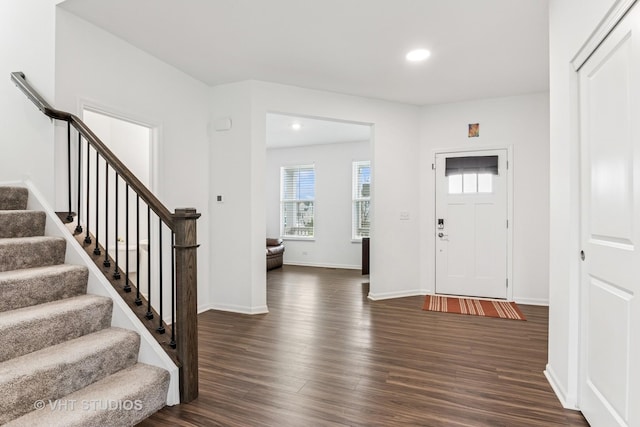 entryway featuring stairway, baseboards, recessed lighting, and dark wood-type flooring