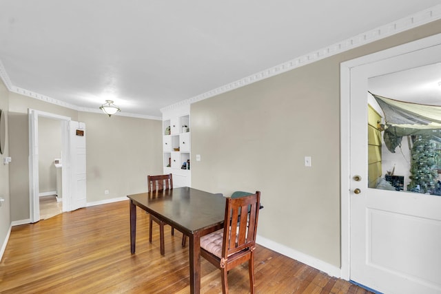 302 Flora Dr, Champaign, IL 61821 - dining space with light wood-style floors and baseboards