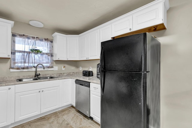 302 Flora Dr, Champaign, IL 61821 - kitchen featuring freestanding refrigerator, stainless steel dishwasher, a sink, and white cabinets