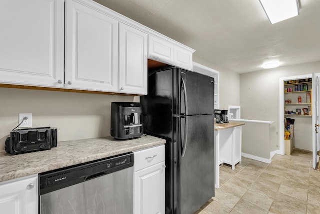 302 Flora Dr, Champaign, IL 61821 - kitchen with dishwasher, freestanding refrigerator, white cabinets, light countertops, and baseboards