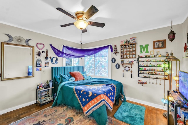 302 Flora Dr, Champaign, IL 61821 - bedroom with wood finished floors, baseboards, crown molding, and ceiling fan