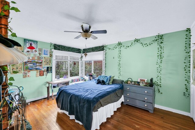 302 Flora Dr, Champaign, IL 61821 - bedroom featuring baseboards, hardwood / wood-style flooring, and ceiling fan