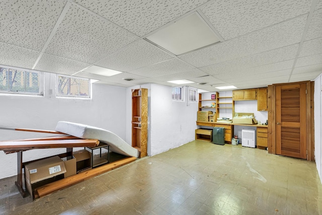302 Flora Dr, Champaign, IL 61821 - basement with light floors and a drop ceiling