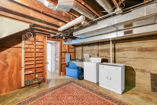 302 Flora Dr, Champaign, IL 61821 - unfinished below grade area featuring washing machine and clothes dryer