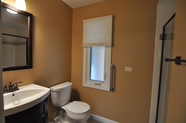 37 Pottowattomie Ct, Naperville, IL 60563 - bathroom with toilet, vanity, a shower with door, and baseboards