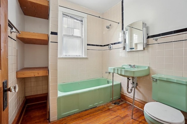 3945 W Dakin St, Chicago, IL 60618 - full bath featuring tile walls, wood-type flooring, and tub / shower combination
