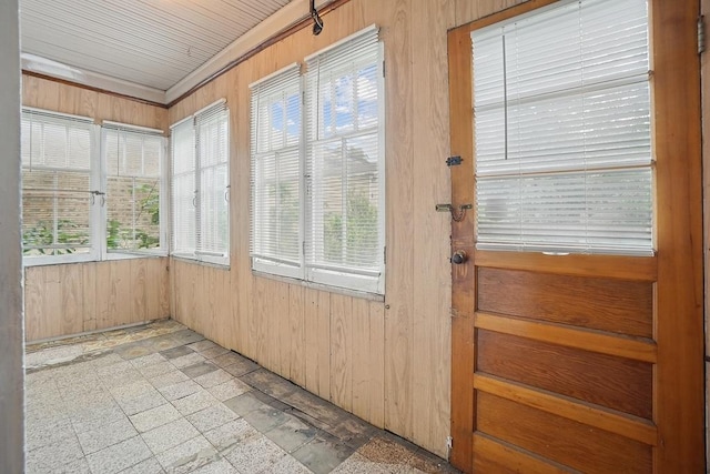 3945 W Dakin St, Chicago, IL 60618 - unfurnished sunroom with wood walls and stone finish flooring