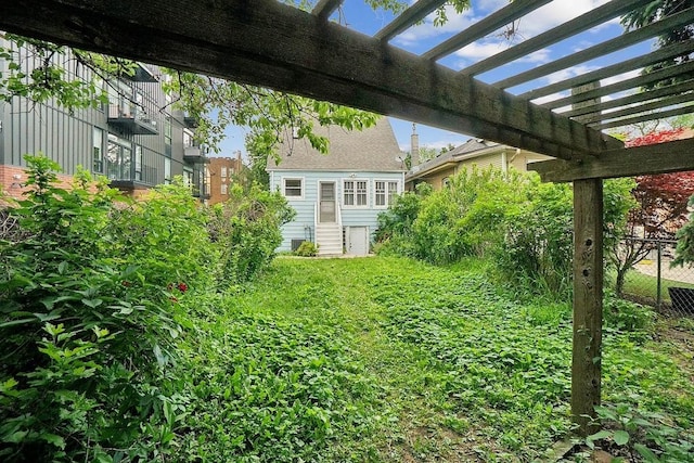 3945 W Dakin St, Chicago, IL 60618 - view of yard featuring a pergola and entry steps