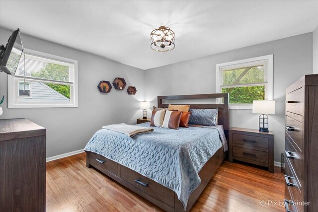 537 71st St, Darien, IL 60561 - bedroom with multiple windows and light wood-type flooring