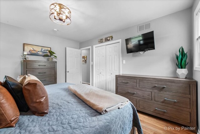 537 71st St, Darien, IL 60561 - bedroom featuring a closet and light wood-style floors