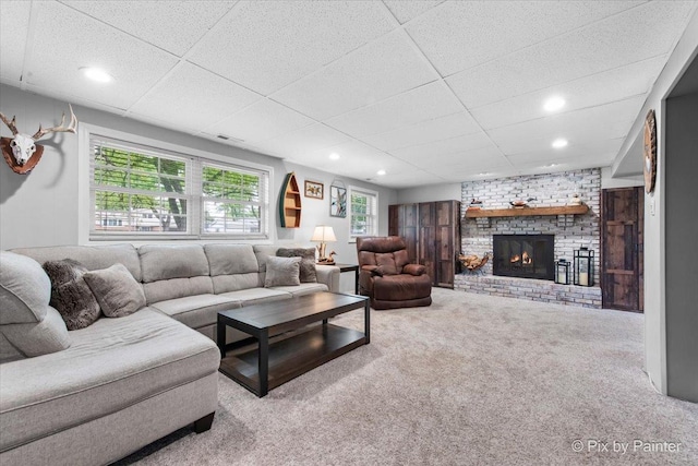 537 71st St, Darien, IL 60561 - carpeted living room with a brick fireplace, a paneled ceiling, and recessed lighting