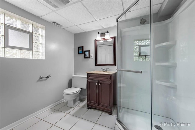 537 71st St, Darien, IL 60561 - bathroom featuring vanity, a shower stall, a drop ceiling, and tile patterned floors