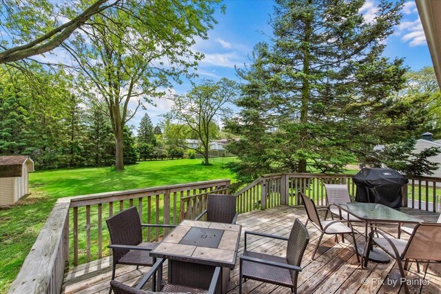 537 71st St, Darien, IL 60561 - wooden deck featuring outdoor dining area, grilling area, a storage shed, and a yard