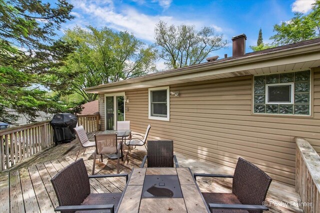537 71st St, Darien, IL 60561 - deck featuring grilling area and outdoor dining area