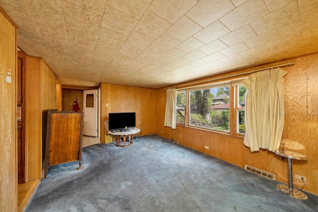 204 N Harvey Ave, Oak Park, IL 60302 - unfurnished living room featuring carpet flooring and wooden walls