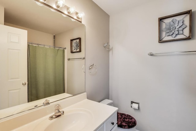 full bathroom with vanity, curtained shower, and toilet