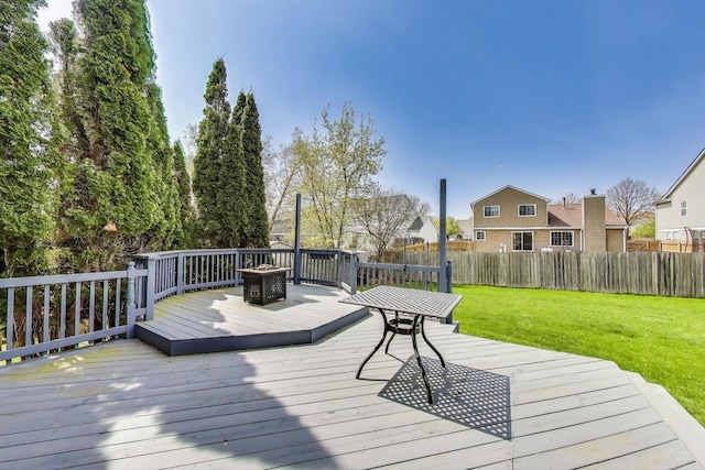 wooden deck with fence and a yard