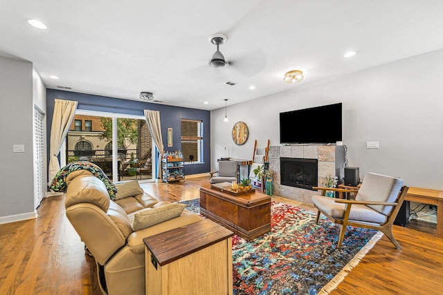 5016 N Sheridan Rd Unit 1, Chicago, IL 60640 - living area featuring recessed lighting, wood finished floors, a ceiling fan, and a tile fireplace