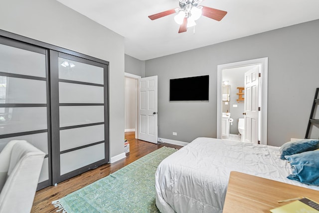 5016 N Sheridan Rd Unit 1, Chicago, IL 60640 - bedroom featuring ensuite bath, wood finished floors, baseboards, and ceiling fan
