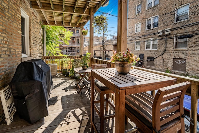 5016 N Sheridan Rd Unit 1, Chicago, IL 60640 - view of wooden balcony featuring outdoor dining space, grilling area, and a wooden deck