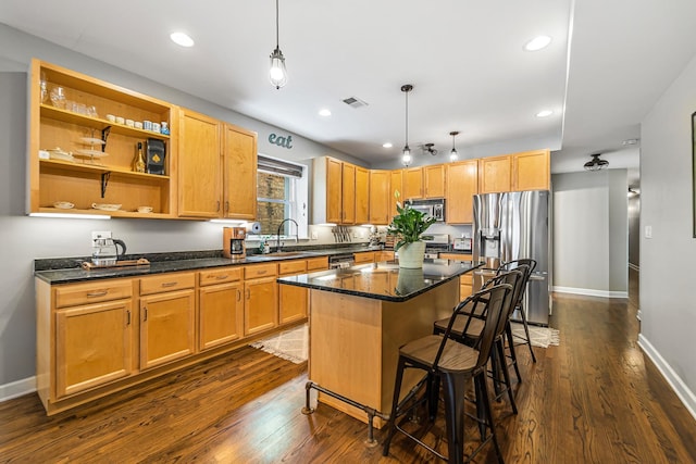 5016 N Sheridan Rd Unit 1, Chicago, IL 60640 - kitchen with dark wood-style flooring, visible vents, appliances with stainless steel finishes, and a sink