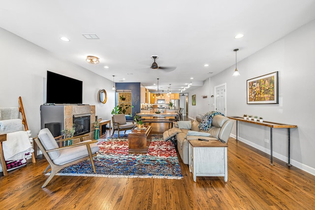 5016 N Sheridan Rd Unit 1, Chicago, IL 60640 - living area with wood finished floors, recessed lighting, ceiling fan, baseboards, and a tile fireplace