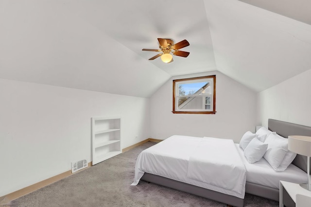 carpeted bedroom featuring baseboards, visible vents, ceiling fan, and lofted ceiling