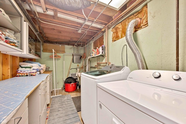 clothes washing area with separate washer and dryer and laundry area